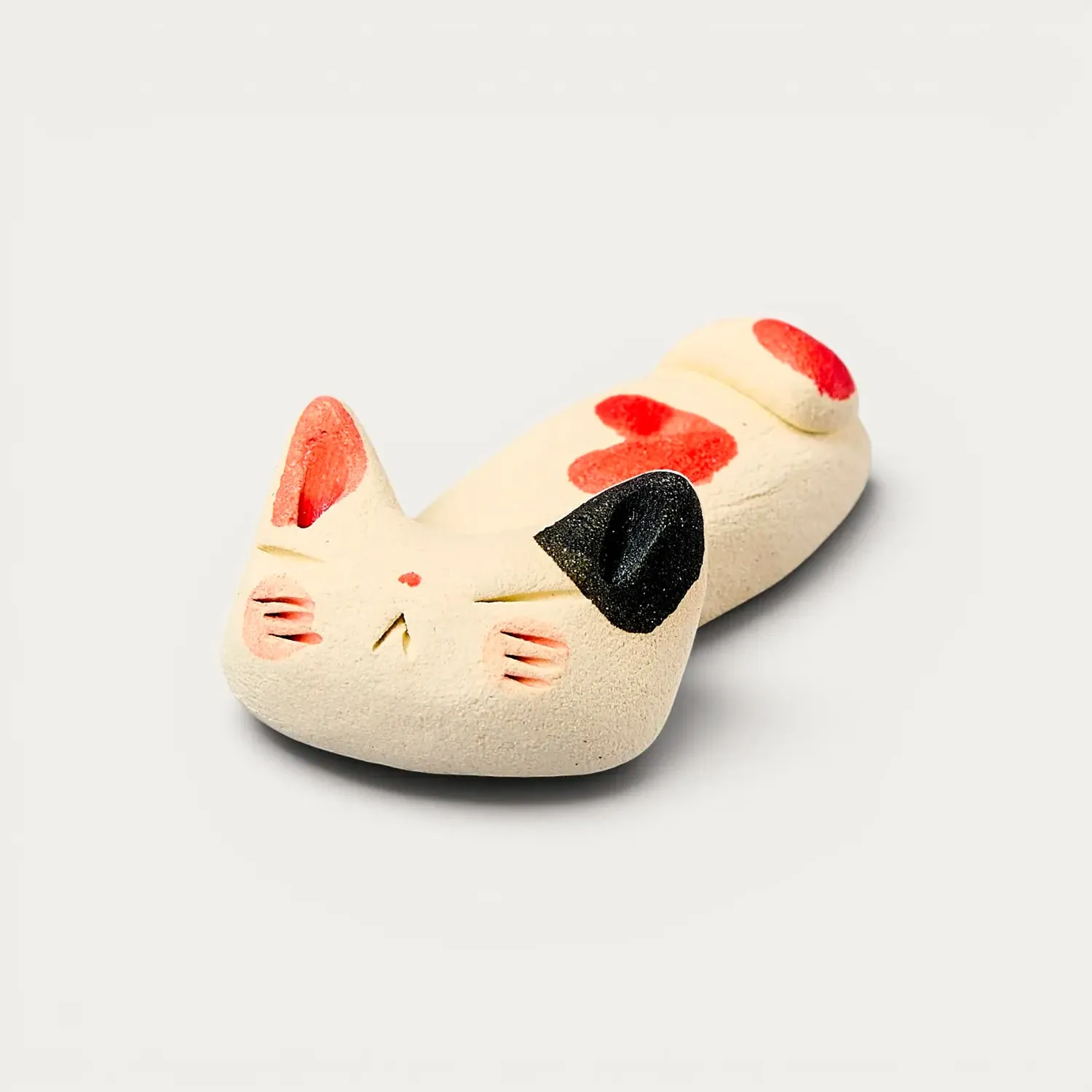 NISHIKIDORI repose-baguettes chat endormi beige céramique